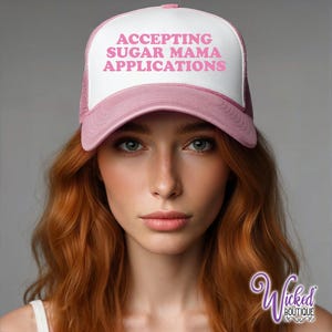 May include: Pink trucker hat with white mesh back and white text that reads "Accepting Sugar Mama Applications".