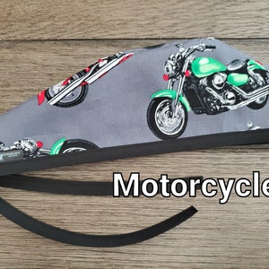 May include: Gray scrub hat with a black trim and a repeated pattern of green and black motorcycles. The text "Motorcycle" is printed below the hat.