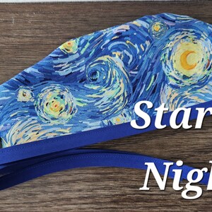 May include: A blue surgical cap featuring a print of Van Gogh's "Starry Night" painting. The cap has a blue trim and ties, with the words "Starry Night" in white script. The cap is made of fabric and is designed for medical professionals.