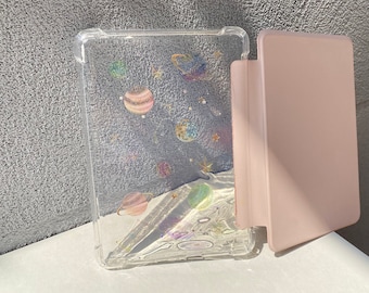 May include: A clear plastic case with a galaxy design and a pink case for an e-reader.