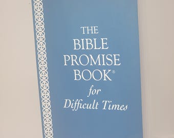 May include: A blue book with a white border and the title "The Bible Promise Book for Difficult Times".