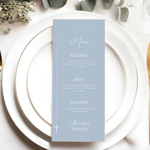 May include: A light blue menu card with a white cross and the text "Alexander's Baptism" at the bottom. The menu includes a starter, main course, and dessert.
