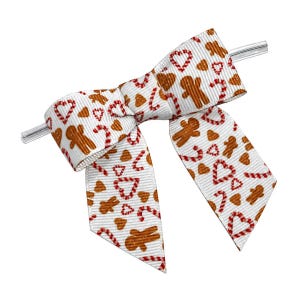 May include: A white ribbon bow featuring a repeating pattern of brown gingerbread men, red and white striped candy canes, and red heart outlines. The ribbon has a ribbed texture and is attached to a clear plastic clip for secure attachment.