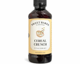 May include: A dark amber plastic bottle with a black screw-top cap, featuring a cream-colored label that reads Sweet Bakes Collection, Cereal Crunch, 4 fl oz (118 mL), and PKBAKES.com, with a graphic of a bowl of colorful cereal loops.