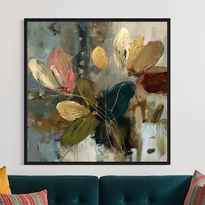 May include: Abstract floral painting in a black frame. The artwork features large, stylized flowers in shades of pink, gold, and green against a muted blue and brown background. The painting hangs above a teal sofa with colorful throw pillows.
