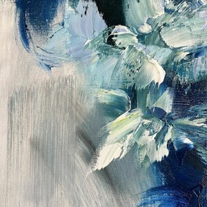 May include: Abstract painting with blue, white, and green brushstrokes on a canvas. The paint is thick and textured, creating a dynamic and expressive piece.