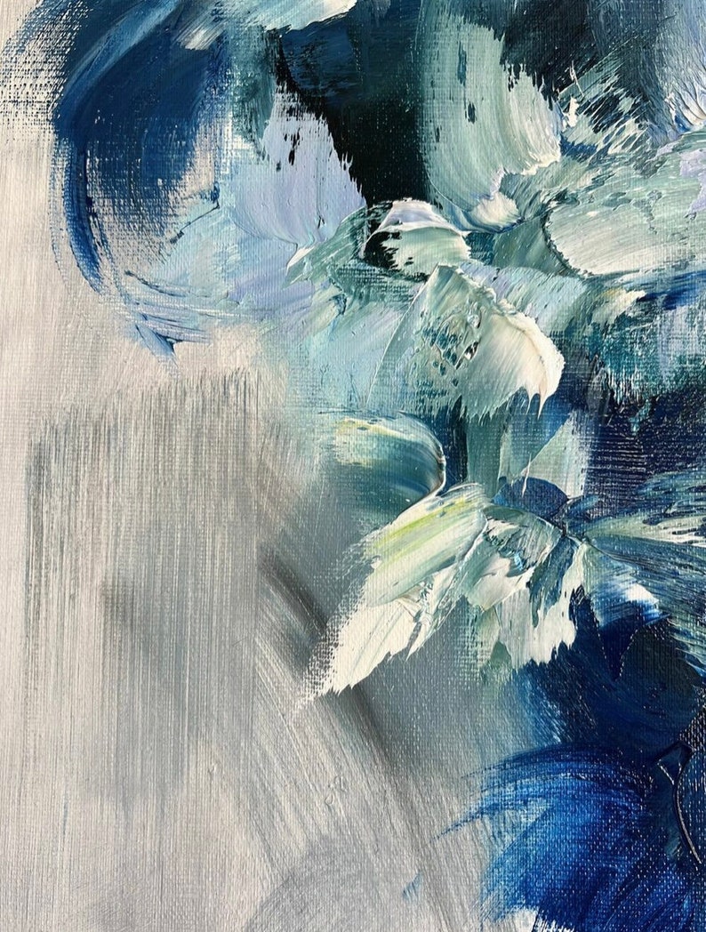 May include: Abstract painting with blue, white, and green brushstrokes on a canvas. The paint is thick and textured, creating a dynamic and expressive piece.