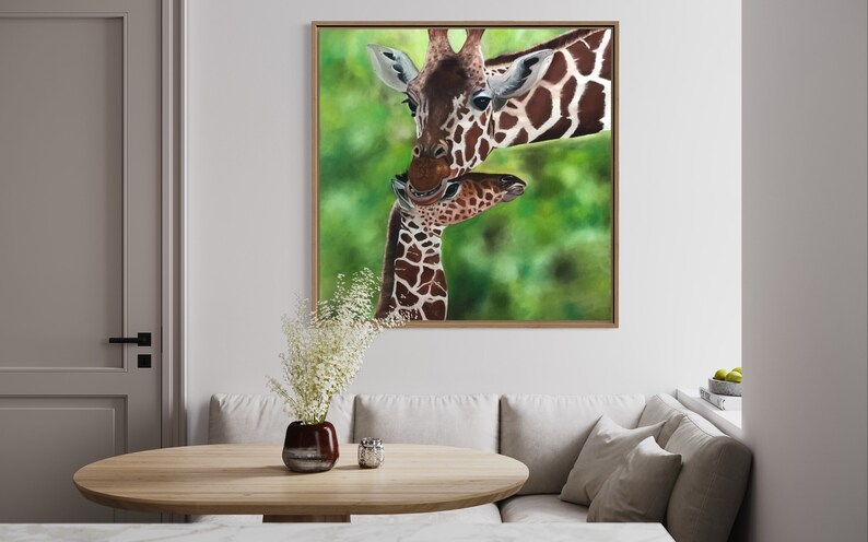 May include: A painting of a mother giraffe and her baby giraffe. The mother giraffe is brown and white with a long neck and a gentle expression. The baby giraffe is smaller and has a more playful expression. The background is a blurred green.
