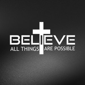 May include: White cross with the words "BELIEVE ALL THINGS ARE POSSIBLE" on a black background.