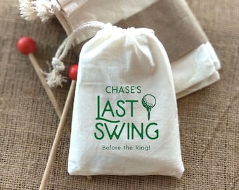 May include: White drawstring bag with the text "CHASE'S LAST SWING Before the Ring!" in green lettering and a golf ball graphic.