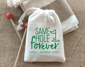 May include: White drawstring bag with green text that reads "Same Hole Forever" and "Colin's Bachelor Party".