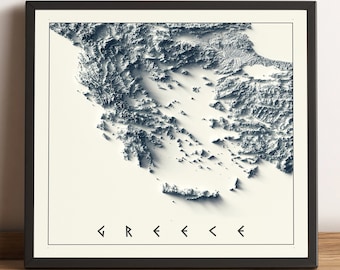 May include: A framed print showing a 3D topographical map of Greece in blue and white tones. The word "GREECE" is printed in stylized text at the bottom. The print is set in a black frame.