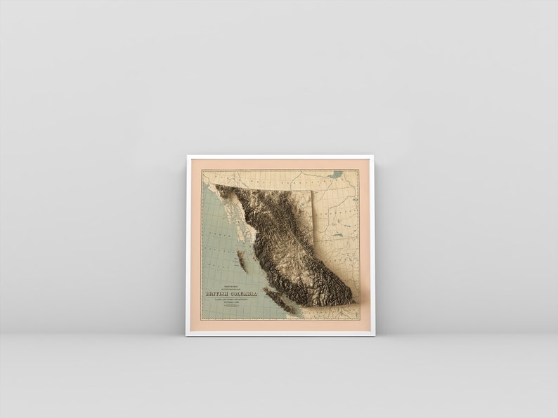 British Columbia vintage framed shaded relief map in white frame. Artistic print highlighting mountains with a realistic 3d effect