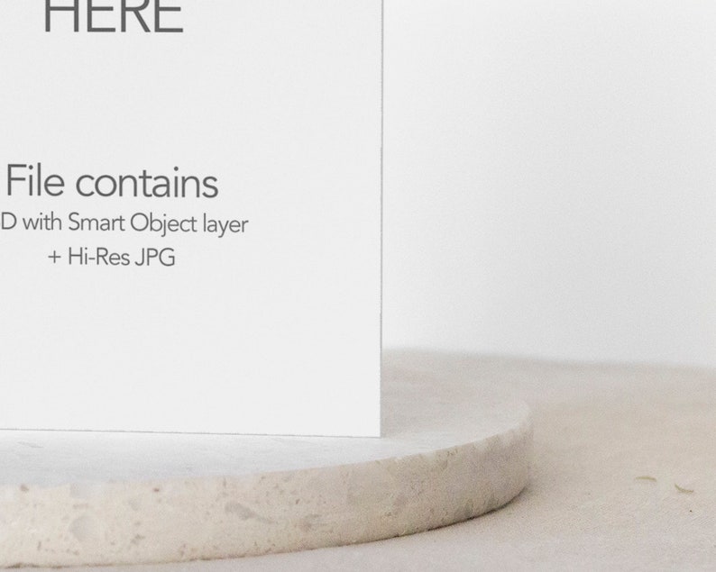 May include: A white card with the text "File contains" followed by "PSD with Smart Object layer + Hi-Res JPG" on a white textured surface.