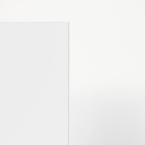 May include: A plain white sheet of paper with a slightly textured surface.