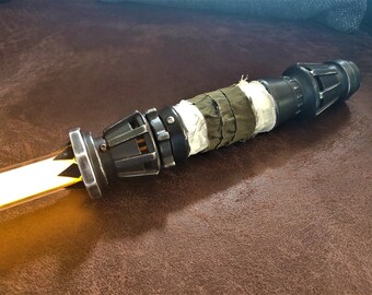 yellow lightsaber toy