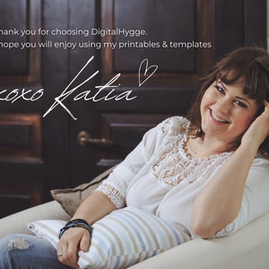 May include: A woman with brown hair smiles while sitting in a white armchair. She is wearing a white lace top and blue jeans. The text "Thank you for choosing Digital Hygge. I hope you will enjoy using my printables & templates xoxo Katia" is written in white on a dark wood background.