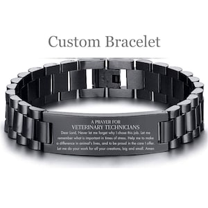 May include: Black stainless steel bracelet with an engraved message that reads "A Prayer for Veterinary Technicians". The message includes a prayer for veterinary technicians to remember what is important in times of stress, to make a difference in animal's lives, and to be proud of the care they offer.