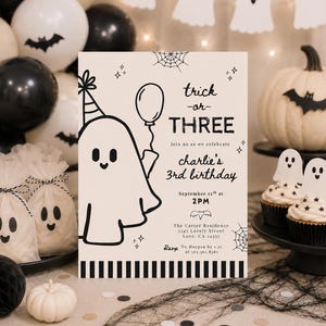 May include: A rectangular birthday invitation card with a cream background and black line art featuring a ghost wearing a party hat and holding a balloon. The text reads: trick or THREE, join us as we celebrate charlie's 3rd birthday, September 12th at 2PM, The Carter Residence 2145 Lovely Street Love, CA 24555, RSVP To Morgan by 1.21 at 565.365.8565.