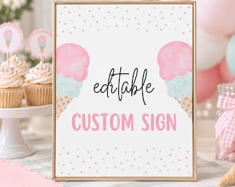 Könnte beinhalten: Ein rechteckiges Schild in einem goldenen Rahmen mit weißem Hintergrund und rosa sowie hellblauen Konfettipunkten. Das Schild zeigt den schwarzen kursiven Text editable und den rosa Blocktext CUSTOM SIGN, flankiert von zwei Aquarell-Eistüten.