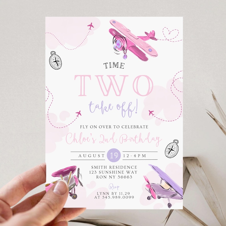 May include: A pink and purple airplane-themed birthday invitation. The invitation reads "Time Two Take Off!" and includes the text "Fly on over to celebrate Chloe's 2nd Birthday". The date and time are also included.