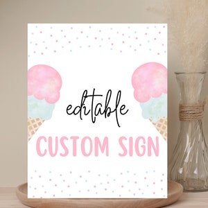 May include: A white sign featuring two watercolour ice cream cones with pink and blue scoops, and waffle cones. The sign reads "editable CUSTOM SIGN" in pink and black script. Pastel confetti dots decorate the top.