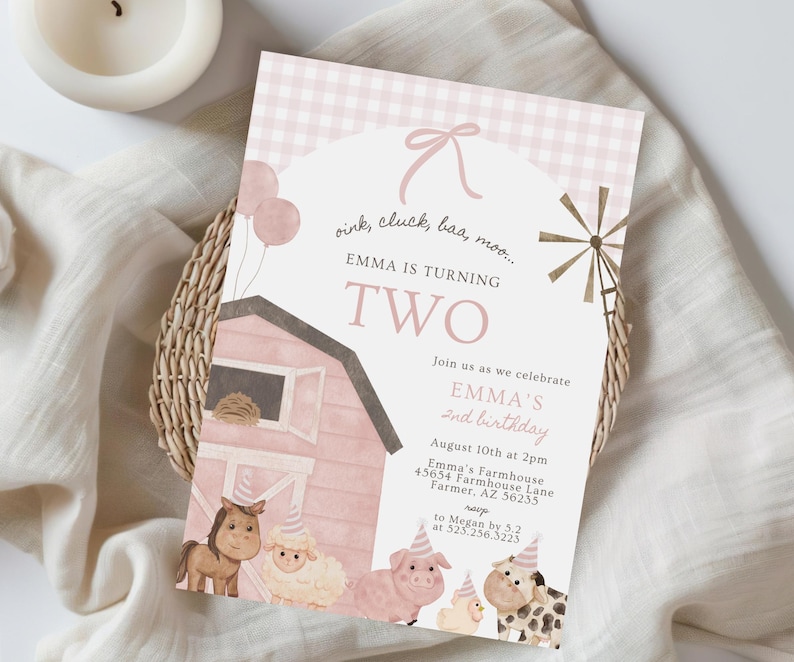 May include: A pink and white birthday invitation with a farm theme. The text reads "Emma is turning two." The design includes illustrations of farm animals, a barn, and a windmill. The invitation includes event details.