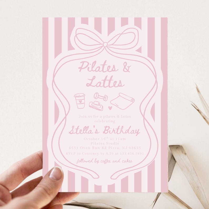 May include: A pink invitation with vertical stripes and a decorative bow design. The text reads "Pilates & Lattes" and "Stella's Birthday." Includes illustrations of a coffee cup, weights, and a yoga mat. The invitation is held by a hand.