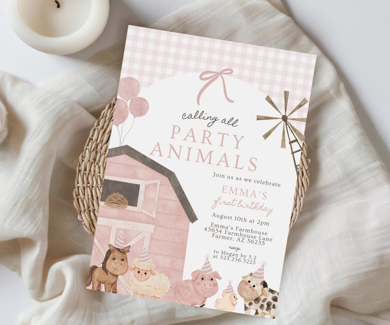 May include: A pink and white invitation with the text "calling all PARTY ANIMALS" and "EMMA'S first birthday". The invitation features illustrations of farm animals, a barn, and a windmill. The invitation is on a woven basket.