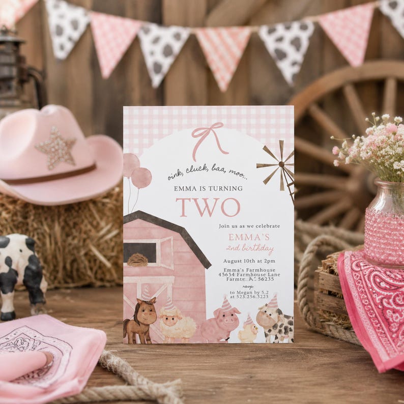 May include: A pink and white birthday invitation with a farm theme. The invitation features a pink barn illustration, farm animals, and the text "EMMA IS TURNING TWO". A pink cowboy hat and a toy cow are also visible.