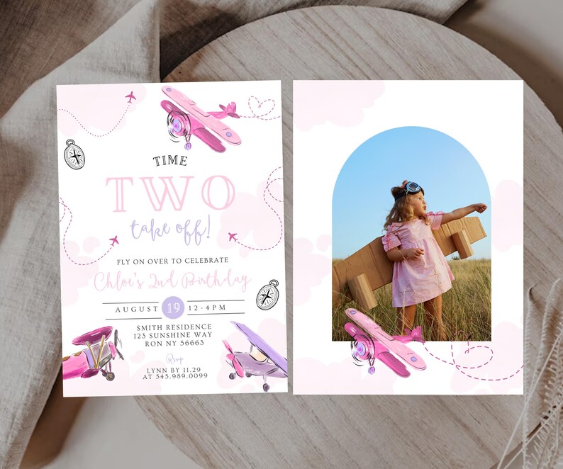 May include: A two-sided invitation with a pink airplane theme. The left side has text that reads "TIME TWO take off!" and details for a birthday party. The right side features a photo of a child with cardboard wings.