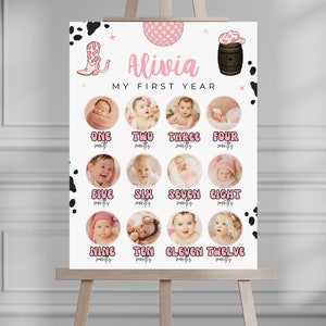 May include: A pink and white first year photo collage with a cowgirl theme. The collage features 12 photos of a baby girl, each representing a month of her first year. The collage is decorated with cow print, a pink cowboy hat, and a pink cowboy boot.