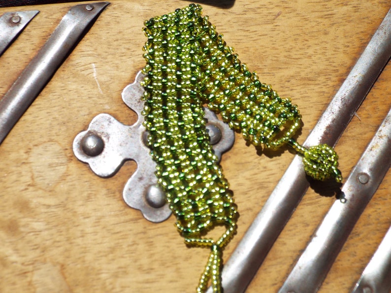 Seed bead bracelet in greens With a ball and loop closure. Native tribal boho Green bracelet
