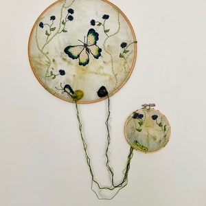Hoop art with eco print and embroidery on silk