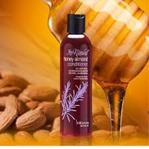 May include: A bottle of honey almond conditioner with a purple label and a rosemary sprig. The bottle is 8 fluid ounces and is made by the brand "In Nature".