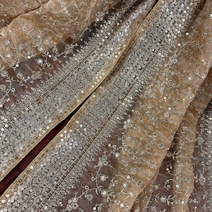 May include: A set of three ceramic mugs with a speckled, matte finish. The mugs are in shades of cream, light gray, and dark gray. Each mug has a simple, minimalist design, perfect for coffee or tea.