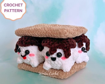 May include: Crochet pattern for a s'mores amigurumi. The s'mores are made of three crocheted marshmallows with chocolate frosting and two graham cracker cookies.