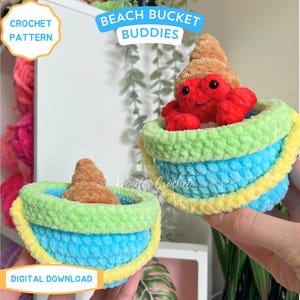May include: Two crochet beach buckets, one with a red crab and the other with a brown ice cream cone. The buckets are blue, green, and yellow. Text on the image says "Beach Bucket Buddies", "Crochet Pattern", and "Digital Download".