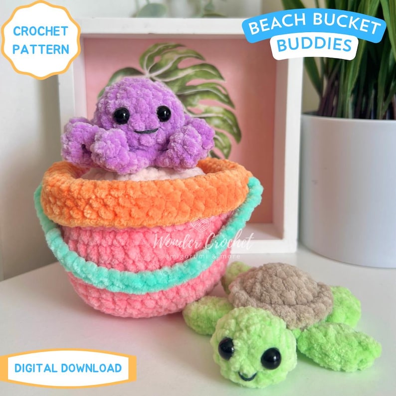 May include: A crocheted beach bucket with a purple octopus and a green turtle. The bucket is pink, orange, and teal. The octopus has a smiling face. The text "Beach Bucket Buddies" and "Crochet Pattern" are visible.