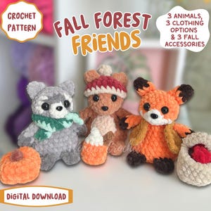 May include: A collection of crocheted fall-themed forest animal toys. The image features a gray raccoon with a green scarf, a brown bear with a red hat, and an orange fox. Accessories include a pumpkin, candy corn, and a bag.
