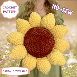 May include: A crochet sunflower pillow pattern. The pillow is yellow with a brown center and is made with a no-sew technique. The pattern is available as a digital download.