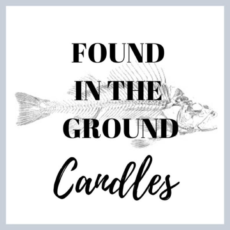 May include: Black and white image of a fish skeleton with the text "FOUND IN THE GROUND Candles" below it.