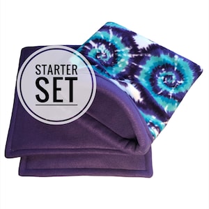 May include: A purple fleece starter set with a tie-dye pattern. The set includes a solid purple base and a top layer with a swirling design in shades of blue, teal, and white. The words "STARTER SET" are printed on the image.