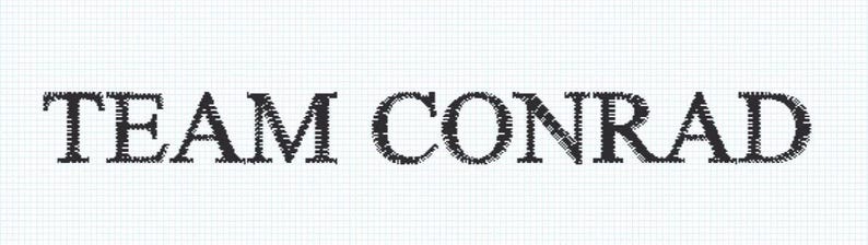 May include: The words "TEAM CONRAD" are displayed in a bold, textured font. The text is in black and appears to be stitched or embroidered, set against a white, grid-patterned background.