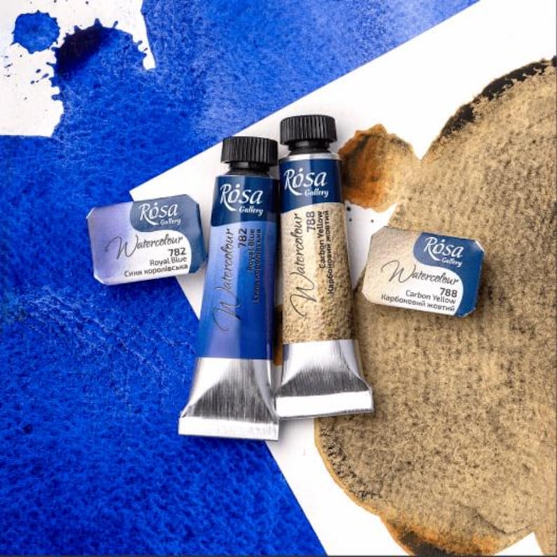May include: Three tubes of Rosa Gallery watercolor paint. The tubes are labeled with the color name and number. The colors are Royal Blue (782), Carbon Yellow (788), and Carbon Yellow (788).