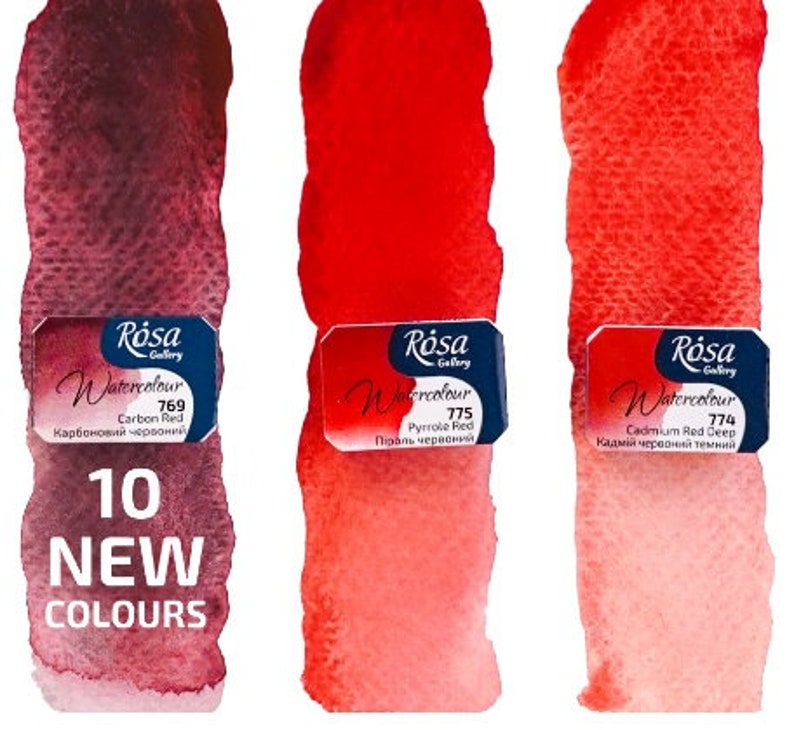 May include: Three watercolour paint tubes in shades of red. The tubes are labelled with the brand name "R&oacute;sa Gallery" and the colour names "Carbon Red", "Pyrrole Red", and "Cadmium Red Deep".
