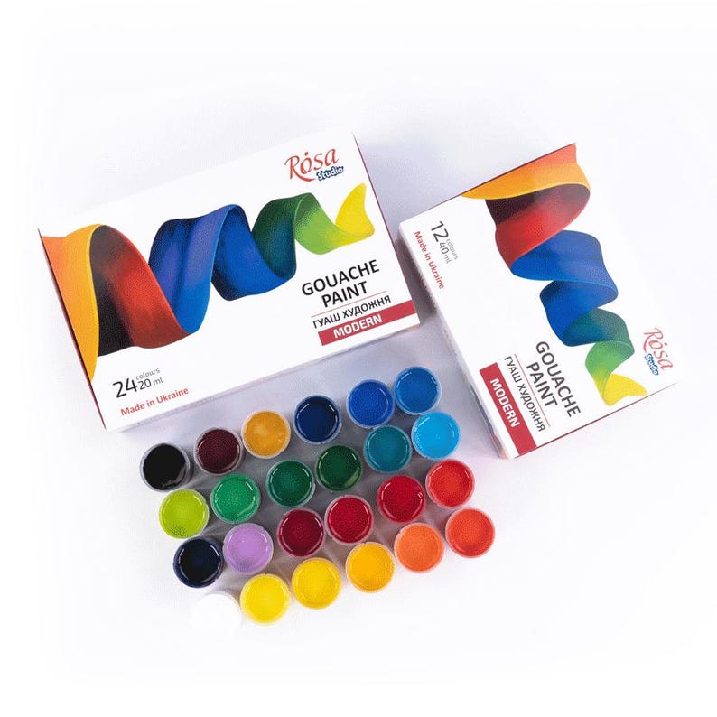 May include: A set of 24 gouache paint tubes in various colors, arranged in a circle. The tubes are labeled "R&oacute;sa Studio Gouache Paint Modern". The paint is made in Ukraine.