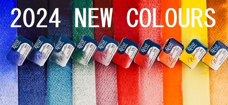 May include: A close-up of ten watercolour paint pans in various colours, including blue, green, red, orange, and yellow. The pans are labelled "Rosa Watercolor" and have a number on each pan. The text "2024 NEW COLOURS" is displayed above the pans.