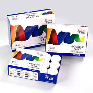 May include: A set of 12 gouache paint tubes in white containers. The tubes are arranged in a circle on a white surface. The paint tubes are labeled "Gouache Paint" and "Rosa Studio". The paint tubes are made in Ukraine.