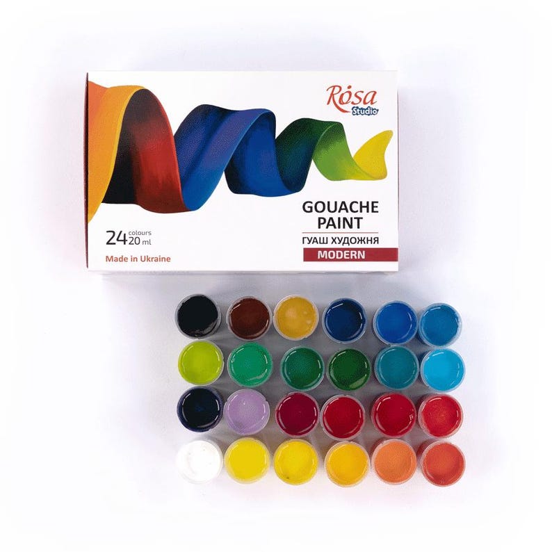 May include: A set of 24 gouache paints in small round containers. The paints are arranged in rows of six, with each row containing a different color. The colors include red, orange, yellow, green, blue, purple, brown, black, and white. The paint set is labeled "Gouache Paint" and "Modern".